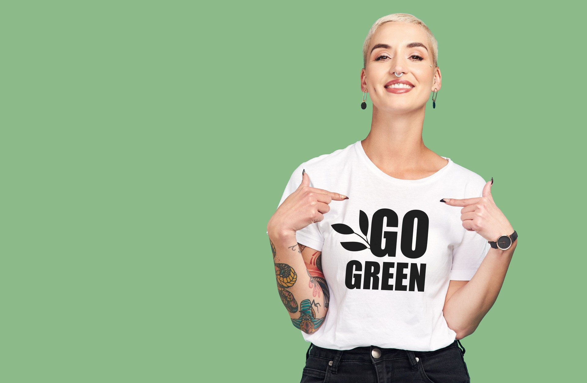Mockup, sustainable fashion and green background, woman with tshirt and space for eco friendly product placement. Sustainability, fashion and climate change influencer with smile and cotton clothes.